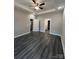 This bedroom features a trey ceiling, ceiling fan, neutral walls and luxury vinyl plank flooring at 1987 Robert Rufty Ln, Catawba, NC 28609