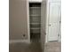 Unfinished closet featuring white shelves and a view of the doorway, awaiting personalized finishing touches at 1987 Robert Rufty Ln, Catawba, NC 28609