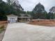 Charming single-story home featuring a spacious driveway, covered porch, and attached garage at 1987 Robert Rufty Ln, Catawba, NC 28609