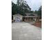 New construction home featuring detached garage, porch, and fresh concrete driveway at 1987 Robert Rufty Ln, Catawba, NC 28609