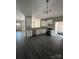 Bright kitchen features white cabinets, stainless steel appliances, and gray wood-look flooring at 1987 Robert Rufty Ln, Catawba, NC 28609