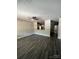 Open-concept living room with stylish flooring and a view into the kitchen at 1987 Robert Rufty Ln, Catawba, NC 28609