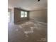 Unfinished room offering natural light, recessed lighting, and outdoor view, awaiting personalized finishing touches at 1987 Robert Rufty Ln, Catawba, NC 28609