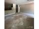 Unfinished room offering multiple doorways, recessed lighting, and a kitchen view, awaiting personalized finishing touches at 1987 Robert Rufty Ln, Catawba, NC 28609