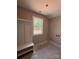 A mudroom boasts a bench and storage with a window looking out on trees at 1987 Robert Rufty Ln, Catawba, NC 28609