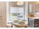Bright breakfast nook with a table, seating, and a large window with backyard views at 2024 Stonewyck Ave, Kannapolis, NC 28081