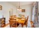Cozy dining room features hardwood floors, an elegant chandelier, and seating for six at 2024 Stonewyck Ave, Kannapolis, NC 28081