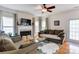 Bright living room features a fireplace, hardwood floors, and modern decor at 2024 Stonewyck Ave, Kannapolis, NC 28081