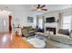 Cozy living room with a fireplace, hardwood floors, and comfortable seating at 2024 Stonewyck Ave, Kannapolis, NC 28081