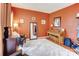 Inviting living room featuring hardwood floors, an area rug, and a piano at 2024 Stonewyck Ave, Kannapolis, NC 28081