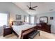 Serene main bedroom featuring a ceiling fan, a dresser, and soft natural light at 2024 Stonewyck Ave, Kannapolis, NC 28081