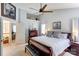 Bright main bedroom boasts a ceiling fan, neutral walls, and comfortable furnishings at 2024 Stonewyck Ave, Kannapolis, NC 28081