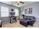 Inviting home office space with a desk, comfortable seating, and natural light from the windows at 2024 Stonewyck Ave, Kannapolis, NC 28081