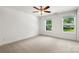 Spacious bedroom features neutral carpet, ceiling fan, and windows offering natural light at 210 N Correll St, Landis, NC 28025