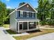 Charming two-story home with a welcoming front porch and beautifully landscaped surroundings at 210 N Correll St, Landis, NC 28025