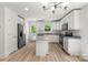 Well-equipped kitchen featuring white cabinets, granite countertops, and stainless-steel appliances at 210 N Correll St, Landis, NC 28025