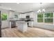 Inviting kitchen featuring white cabinets, granite countertops, and modern stainless steel appliances at 210 N Correll St, Landis, NC 28025