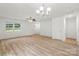 Inviting living room with hardwood floors, neutral walls, and ample natural light from a large window at 210 N Correll St, Landis, NC 28025