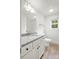 Bathroom featuring granite countertops, updated fixtures, and wood look flooring at 212 N Correll St, Landis, NC 28025