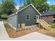 Exterior of a home featuring a newly installed back deck and neutral siding at 212 N Correll St, Landis, NC 28025