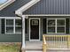 Close up on the front of the house showing the door, house number and a small porch at 212 N Correll St, Landis, NC 28025