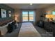 Bright bedroom featuring a large window, comfortable bed, and decor accents at 216 Laura Elizabeth Ln, Clover, SC 29710