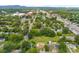 Expansive aerial view of a neighborhood with mature trees, highlighting the community setting and local amenities at 217 S Highland St, Gastonia, NC 28052