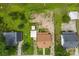 Aerial view of a property with a brown roof and surrounding green spaces, showcasing its lot size at 217 S Highland St, Gastonia, NC 28052