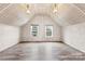 Well-lit attic space with contemporary floors, white walls, and dormer windows providing plenty of natural light at 217 S Highland St, Gastonia, NC 28052