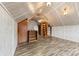 Bright and spacious attic showcasing sloped ceilings, built-in storage, and modern flooring at 217 S Highland St, Gastonia, NC 28052