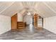 Large attic with built-in shelving and finished floors, offering ample storage and potential living space at 217 S Highland St, Gastonia, NC 28052