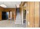 Spacious entryway with adjacent stairs and open doorway to other rooms, providing ample space at 217 S Highland St, Gastonia, NC 28052