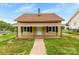 Charming one-story house with a covered front porch and well-maintained lawn at 217 S Highland St, Gastonia, NC 28052