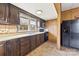 Bright kitchen featuring dark cabinets, modern appliances, and a double basin sink at 217 S Highland St, Gastonia, NC 28052
