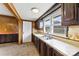 Kitchen featuring classic cabinetry, a double sink, and a view to the front yard at 217 S Highland St, Gastonia, NC 28052