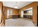 Kitchen view showcasing wood paneled walls and a vintage overhead light at 217 S Highland St, Gastonia, NC 28052