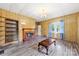 Bright living room showcasing a fireplace, shelving, and a pair of windows at 217 S Highland St, Gastonia, NC 28052