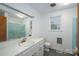 Bathroom with vanity and shower with blue accents at 2212 10Th Ne Ave, Hickory, NC 28601