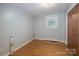 A room with wood floor and one window at 2212 10Th Ne Ave, Hickory, NC 28601