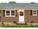 Close up on the front door, windows, and brick facade at 2212 10Th Ne Ave, Hickory, NC 28601