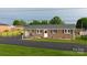 Traditional brick home with attached carport and manicured lawn at 2212 10Th Ne Ave, Hickory, NC 28601