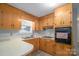 Eat-in kitchen features wood cabinetry and modern appliances at 2212 10Th Ne Ave, Hickory, NC 28601