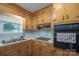 Eat-in kitchen features wood cabinetry and modern appliances at 2212 10Th Ne Ave, Hickory, NC 28601