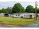 Spacious grassy yard showing home exterior with a carport and nice neighborhood at 2212 10Th Ne Ave, Hickory, NC 28601