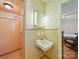 Retro bathroom featuring shower stall, sink, vintage tile, and wallpaper at 2216 Griffith Rd, Monroe, NC 28112