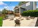 Backyard oasis with a hot tub, fire pit, Adirondack chairs, and a well-maintained lawn for outdoor enjoyment at 2217 Yadkin Ave, Charlotte, NC 28205