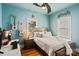 Bedroom with modern furniture, desk, guitars, and a window with outside view at 2217 Yadkin Ave, Charlotte, NC 28205