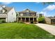 Inviting two-story home with a spacious front lawn and charming exterior details and a welcoming porch at 2217 Yadkin Ave, Charlotte, NC 28205