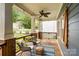 Inviting front porch with cozy chairs, a swing, and decorative accents creating a relaxing outdoor space at 2217 Yadkin Ave, Charlotte, NC 28205