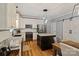 Modern kitchen features white cabinets, stainless steel appliances, granite countertops and an island at 2217 Yadkin Ave, Charlotte, NC 28205